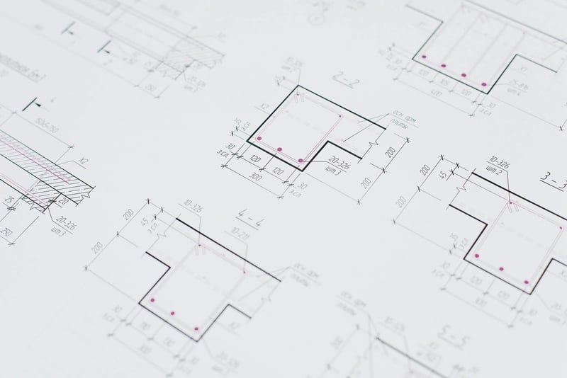 Patent technical drawing on engineer desk — Swiss patent registration