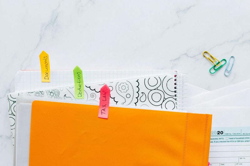 Tax document folder on office desk — Swiss cantonal tax ruling
