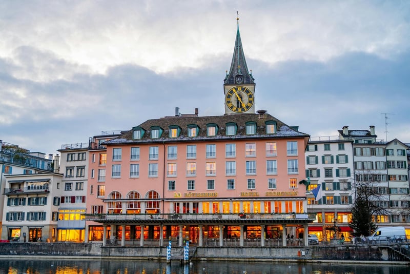 Geneva private banking building facade — Swiss banks onboarding crypto companies require beneficial-owner attestations, source-of-wealth documentation, and a business model mapped to the relevant FINMA licence category