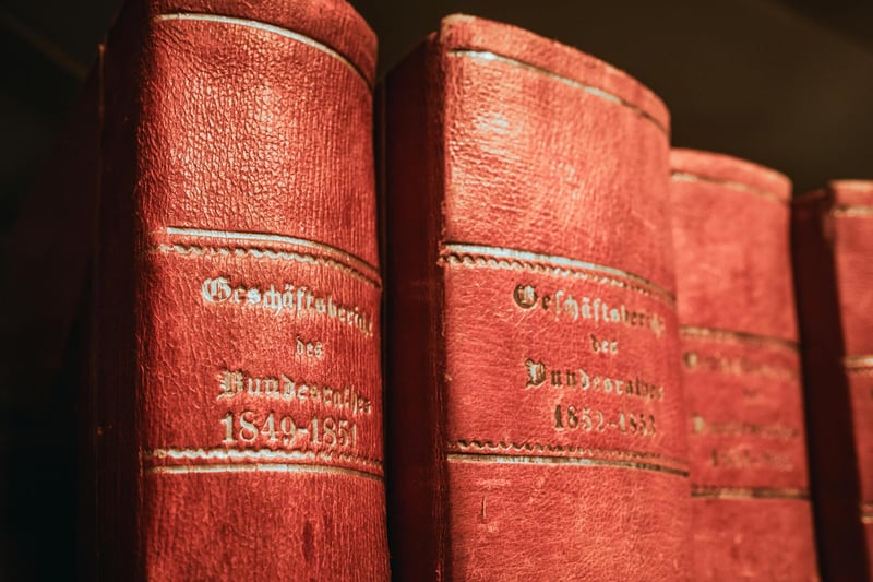 Modern Swiss boardroom with governance documents — substance requirements including physical office, Swiss-resident signatories, and documented board minutes anchor a family office's cantonal tax residency